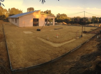  Filled, compacted, plumbing, electrics done, footings laid and levelled.  