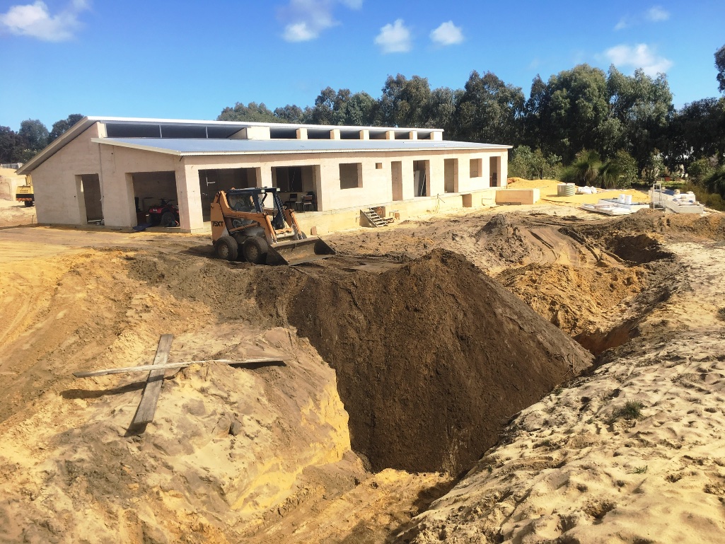  Filling in the 'pit' that was used for clean sand 